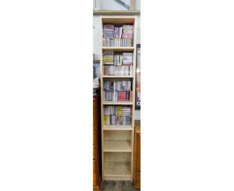 A tall light beech finished open bookshelf unit 16" wide and a very large quantity of unused classical CD's 