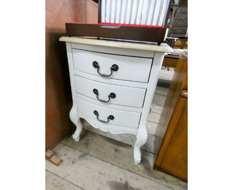 A modern cream and light oak bow front bedside chest with three drawers 