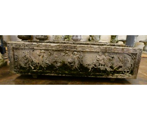 A large rectangular reconstituted stone weathered garden trough decorated with peacocks and foliage, 42" long, 14" wide  