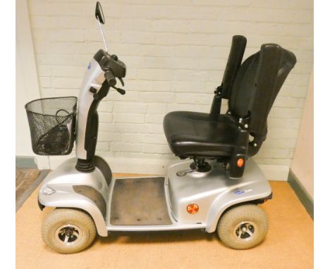 A silver Invacare four wheel pavement mobility scooter in good condition with charger