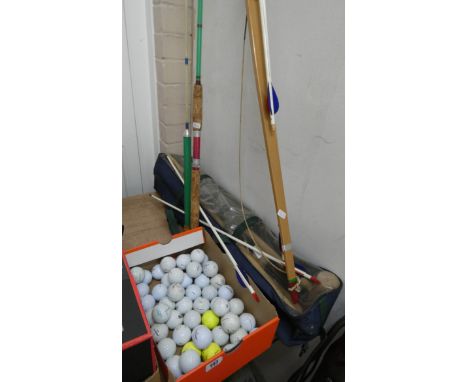 Two fishing rods, a bow and arrow, golf balls, a small croquet set etc 