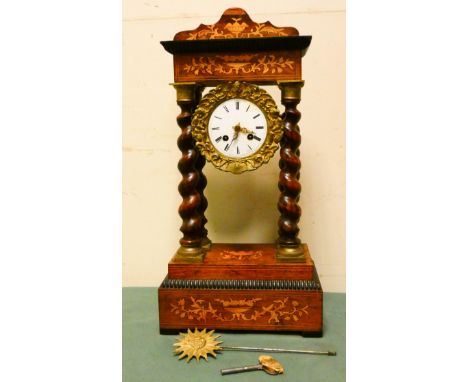 A French empire inlaid Rosewood portico clock with barley twist columns and striking movement 