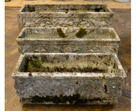 A small rectangular reconstituted stone weathered garden trough decorated with peacocks and foliage, 28" long, 10" wide  