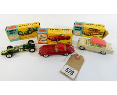 Three boxed Corgi toy cars to include the Ford Console Classic Model number 234, The E-Type Jaguar Model number 307 and a Lot