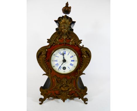 A French walnut and gilt metal mounted mantle clock with circular enamel dial and blue Roman numerals with key, height 32cms 