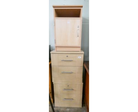 A pair of light oak two drawer bedside chests and a light beech bedside cabinet 