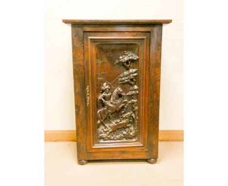 A French oak cupboard with highly carved hunting scene of a hunter on horseback chasing a deer, 31" wide, 44" high 