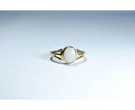 A 9ct yellow gold ring set with an opal, ring size N 1/2, weight approximately 2.2g