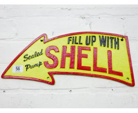 A large arrow shaped Shell cast iron wall plaque 