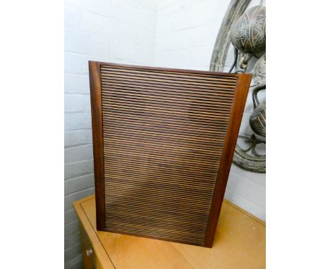 A modern speaker in teak case 