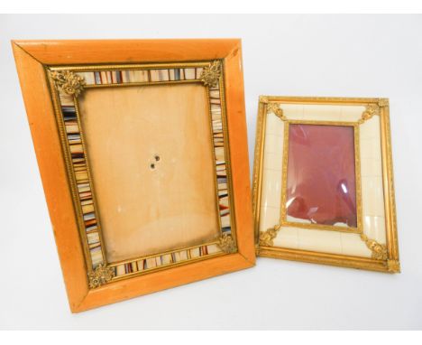 Two vintage gilt metal mounted and mother of pearl inlaid photograph frames the largest measuring 25cms tall 
