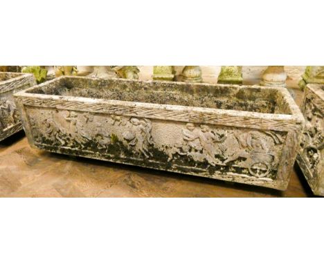 A large reconstituted stone weathered garden trough decorated in relief with classical scenes each trough measures 48" long, 