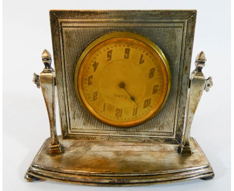 A hall marked silver dressing table clock in an easel stile stand, width 12cm   As found 