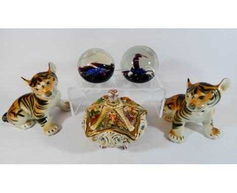 Two Caithness glass paperweights, two Russian pottery tigers and a Capi De Monte trinket box and cover 