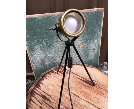 A HEAVY BRASS CARBIDE TABLE LAMP MOUNTED ON A LATER BLACK PAINTED TRIPOD STAND 