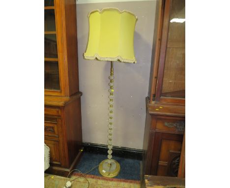 A VINTAGE GLASS AND BRASS EFFECT STANDARD LAMP
