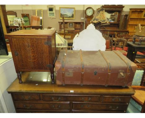 A SMALL OAK BEDSIDE CUPBOARD TOGETHER WITH A VINTAGE BANDED PACKING TRUNK (2)