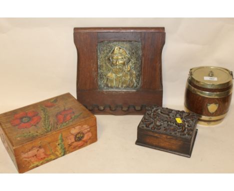 AN OAK AND BRASS WALL HANGING PIPE RACK TOGETHER WITH A CARVED OAK TRINKET BOX, FLORALLY PAINTED EXAMPLE AND A BISCUIT BARREL