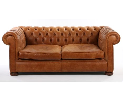 Leather Chesterfield settee, with a button back and sides above bun feet, 191cm wide, 102cm deep, 76cm high