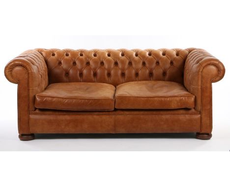 Leather Chesterfield settee, with a button back and sides above bun feet, 191cm wide, 102cm deep, 76cm high