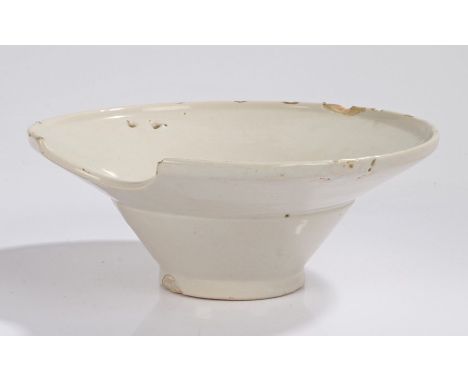 19th Century Barbers creamware basin, the deep circular bowl with chin groove and dual holes for a loop, 27cm wide