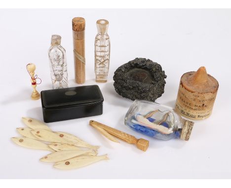 Collection of objects, to include a miniature ship in a bottle, a coin set in tar, a collection of bone fish, two lavender wa