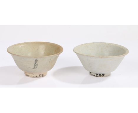 Vung Tau cargo, two Chinese porcelain bowls, circa 1690, Kangxi period, with faded blue line decorated to the interior and de