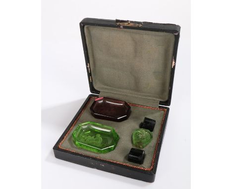 Two 19th Century glass pin trays with intaglio decoration, housed within a later fitted case 