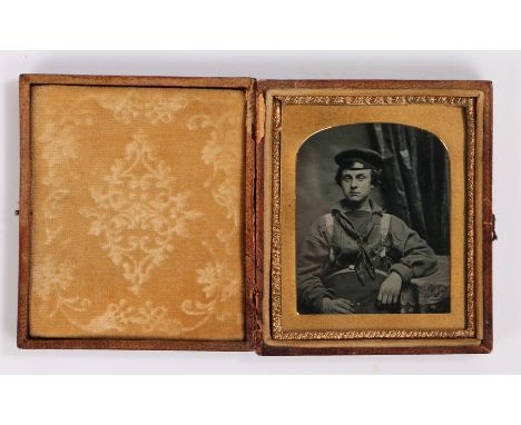 19th Century sixth plate ambrotype of a sailor, seated position with an arm resting on a table, housed within the original ca