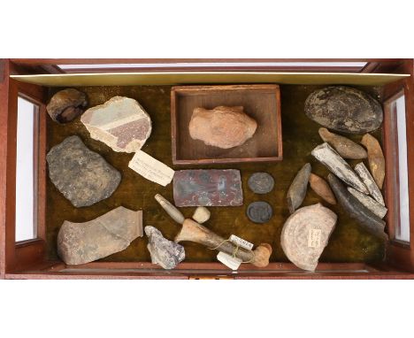 An intriguing collection of objects, to include a bone section from Southwold, pottery flask, an ancient pottery head, potter