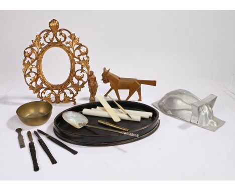 Collection of objects, to include a nut cracker in the form of a horse, a gilt metal mirror, a stand, a shell spoon, a mould,
