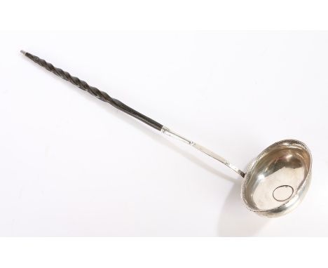 19th Century silver and whale baleen toddy ladle, with a coin set to the ladle and a twisted baleen handle, 32cm long