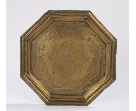 19th Century Indian brass dish, with Durga, four armed, holding trident, severed head, sword and elephant goad, animals and s