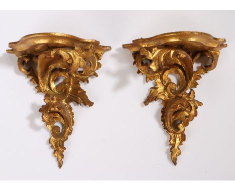 Pair of gilt wood rococo wall brackets, with a shaped shelf and acanthus scroll brackets, 20cm high, 17cm wide, (2)