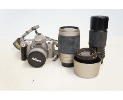 Nikon camera with 3 additional lenses