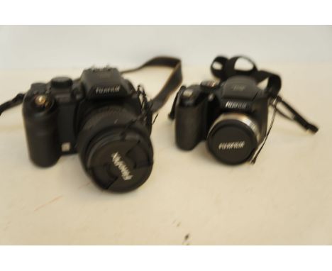 Fuji film fine pix S9600 digital camera with 1 other Fuji film both with soft cases