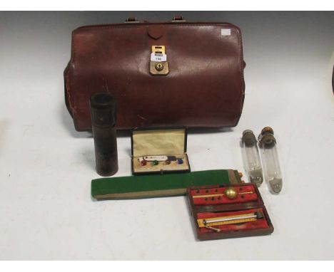 A Sikes hydrometer together with various alcohol testing kits