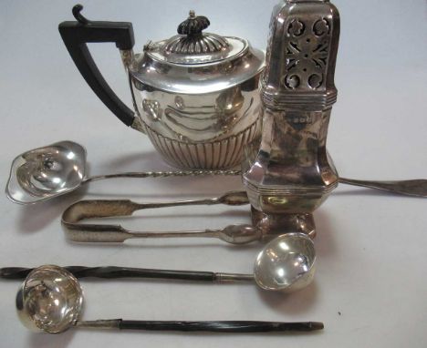 A silver teapot, together with a silver sugar caster, two toddy ladles with silver bowls, a silver plated punch ladle and a p