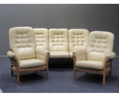 An Ercol three piece suite comprising of a three seater sofa and a pair of arm chairs, together with another armchair, width 