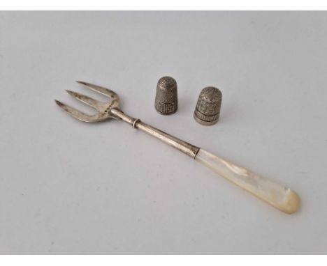 An Mop Handled Fork And Two Thimbles