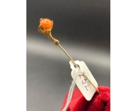 A Antique Eagles Claw Stick Pin Clutching Coral