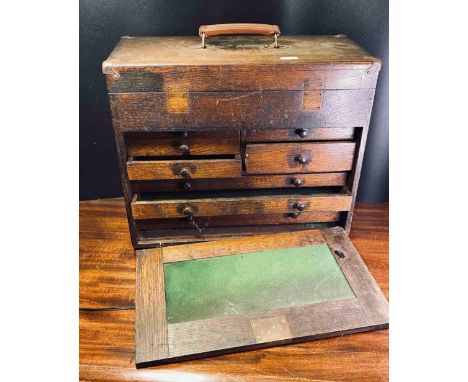 A Good Oak Watchmakers Tool Cabinet With Drawers Behind Sliding Door