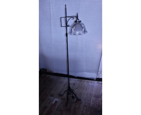 A wrought iron with a halothane glass shade floor lamp, shipping unavailable 