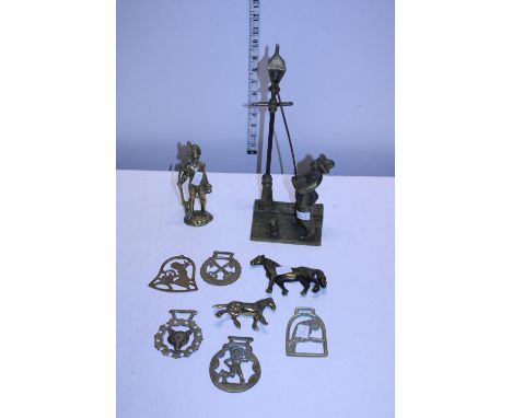 A job lot of assorted brass ware including a heavy lamp lighter figure 