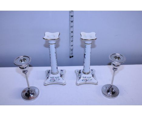 A pair of Coalport ceramic candlesticks and pair of silver plated candlesticks 