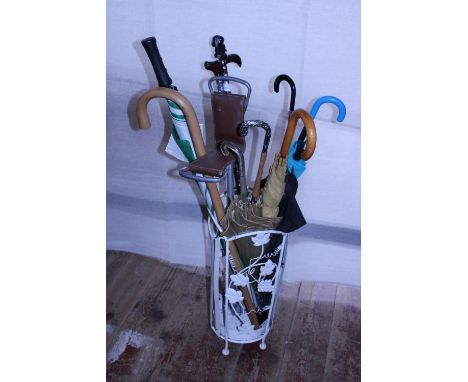 A vintage metal umbrella/stick stand and contents, shipping unavailable 