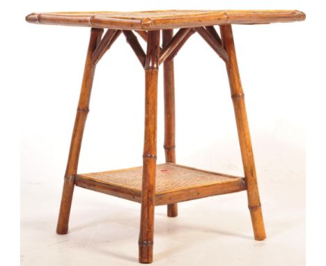 A 19th century Bamboo Aesthetic movement occasional table of square form having four angular supports united by a magazine tr