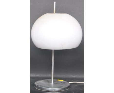 A retro vintage mid 20th century circa 1970s Harvey Guzzini mushroom desk top lamp having a white globular shade raised on a 