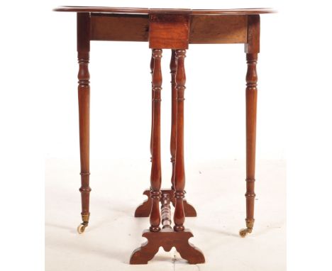 A 1930's&nbsp; oak drop leaf Sutherland table. The occasional table with turned uprights united by a lower tier having swing 