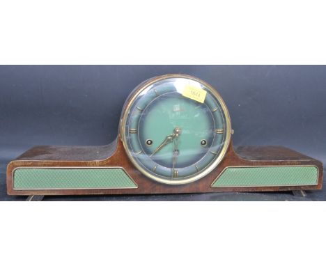 An early 20th century circa. 1940s Art Deco style Lauffer Napoleon mantle clock having a green face with gilt numerals and fa